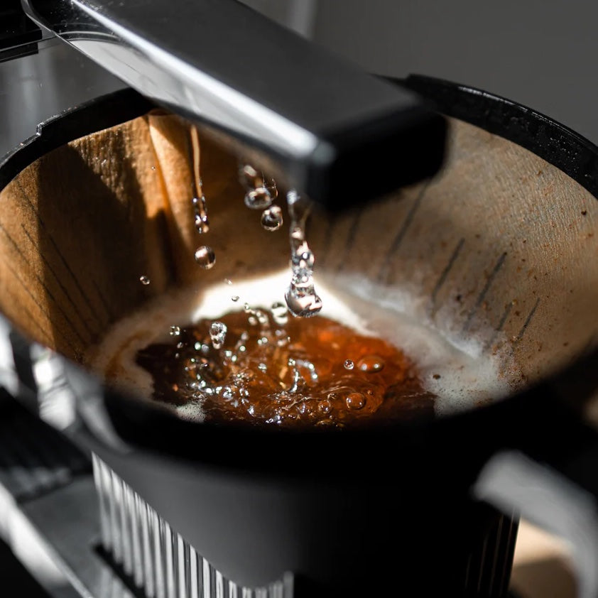 Moccamaster KBGV coffee brewer water dripping into brew basket